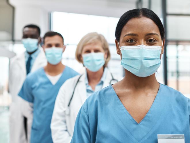 Doctors standing together united  Doctors standing together united