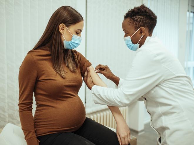 Pregnant woman receiving COVID vaccine  Pregnant woman receiving COVID vaccine