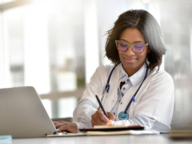 doctor_doing_paperwork_at_desk.png doctor_doing_paperwork_at_desk.png