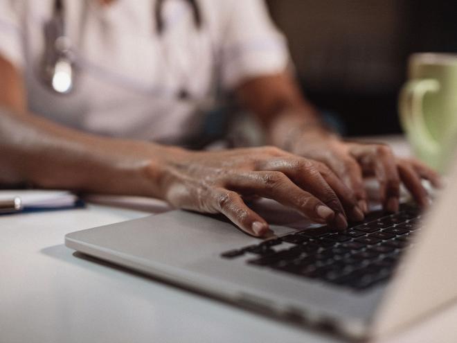 pay-close-up-doctor-typing-on-laptop.jpg