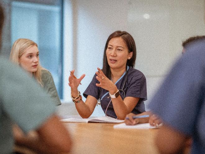 pay-doctor-speaking-at-meeting.jpg