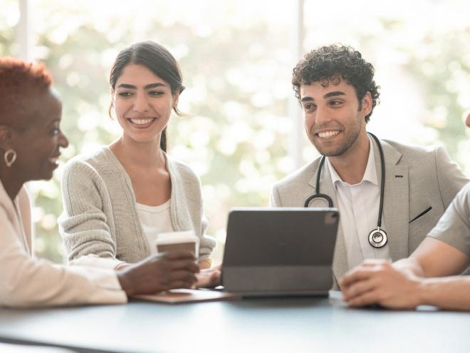 Physician leaders gathered at a table.