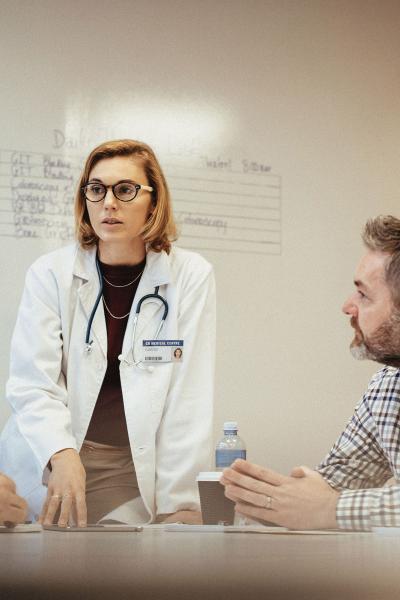 Doctors speaking in a meeting room. 