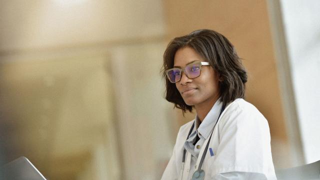 A doctor looking at their laptop.